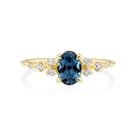 Ring with Blue Topaz and 0.12 Carat TW of Diamonds in 10kt Yellow Gold Ring with Blue Topaz and 0.12 Carat TW of Diamonds in 10kt Yellow Gold