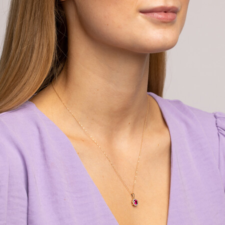 Halo Pendant with Laboratory Created Ruby & Natural Diamonds in 10kt Yellow Gold Halo Pendant with Laboratory Created Ruby & Natural Diamonds in 10kt Yellow Gold