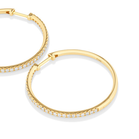 Huggies with 0.60 Carat TW of Diamonds in 10kt Yellow Gold Huggies with 0.60 Carat TW of Diamonds in 10kt Yellow Gold