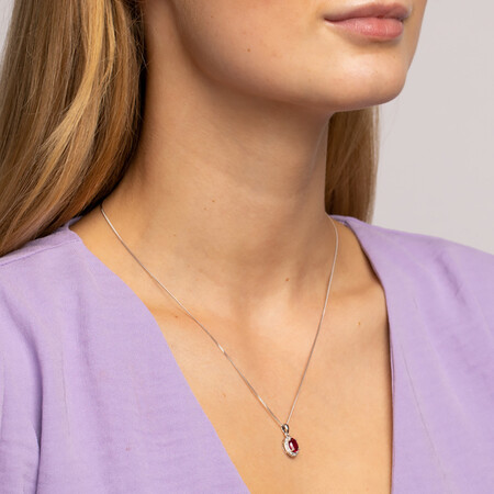 Halo Pendant with Created Ruby and 0.04 TW of Diamonds in Sterling Silver Halo Pendant with Created Ruby and 0.04 TW of Diamonds in Sterling Silver