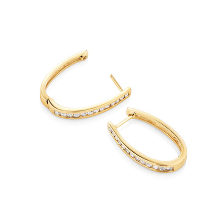 Oval Huggie Earrings with 0.50 Carat TW of Diamonds in 10kt Yellow Gold Oval Huggie Earrings with 0.50 Carat TW of Diamonds in 10kt Yellow Gold