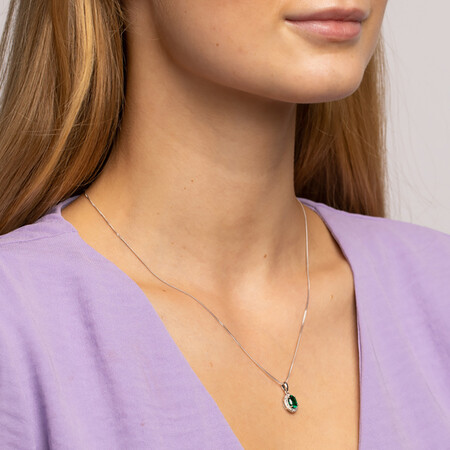 Halo Pendant with Created Emerald and 0.04 TW of Diamonds in Sterling Silver Halo Pendant with Created Emerald and 0.04 TW of Diamonds in Sterling Silver