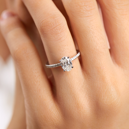 Engagement Ring with 1.14 Carat TW of Diamonds. A 1 Carat Oval Centre Laboratory-Created Diamond and shouldered by 0.14 Carat TW of Natural Diamonds in 14kt White Gold Engagement Ring with 1.14 Carat TW of Diamonds. A 1 Carat Oval Centre Laboratory-Created Diamond and shouldered by 0.14 Carat TW of Natural Diamonds in 14kt White Gold
