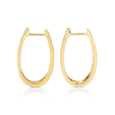 Oval Huggie Earrings with 0.50 Carat TW of Diamonds in 10kt Yellow Gold Oval Huggie Earrings with 0.50 Carat TW of Diamonds in 10kt Yellow Gold