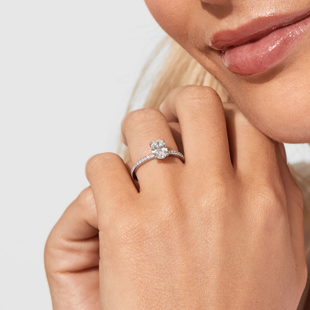 Engagement Ring with 1.14 Carat TW of Diamonds. A 1 Carat Oval Centre Laboratory-Created Diamond and shouldered by 0.14 Carat TW of Natural Diamonds in 14kt White Gold Engagement Ring with 1.14 Carat TW of Diamonds. A 1 Carat Oval Centre Laboratory-Created Diamond and shouldered by 0.14 Carat TW of Natural Diamonds in 14kt White Gold