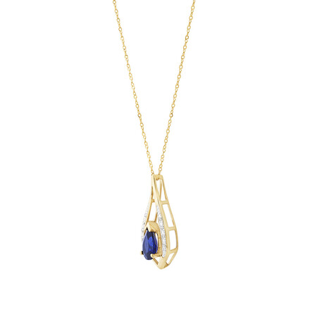 Pendant with Laboratory Created Sapphire & Natural Diamonds in 10kt Yellow Gold Pendant with Laboratory Created Sapphire & Natural Diamonds in 10kt Yellow Gold