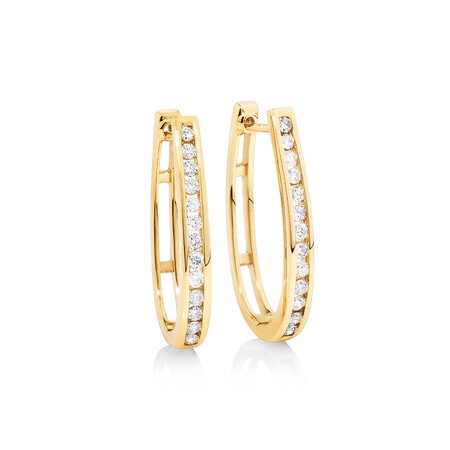 Oval Huggie Earrings with 0.50 Carat TW of Diamonds in 10kt Yellow Gold Oval Huggie Earrings with 0.50 Carat TW of Diamonds in 10kt Yellow Gold