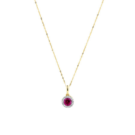 Halo Pendant with Laboratory Created Ruby & Natural Diamonds in 10kt Yellow Gold Halo Pendant with Laboratory Created Ruby & Natural Diamonds in 10kt Yellow Gold