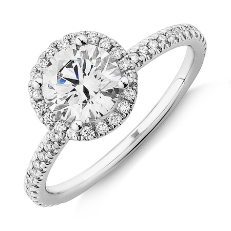 Halo Engagement Ring with 1.23 Carat TW of Diamonds. A 1 Carat Round Brilliant Laboratory-Created Centre Diamond and 0.23 Carat TW of Natural Diamonds in the Shoulders and Halo in 14kt White Gold Halo Engagement Ring with 1.23 Carat TW of Diamonds. A 1 Carat Round Brilliant Laboratory-Created Centre Diamond and 0.23 Carat TW of Natural Diamonds in the Shoulders and Halo in 14kt White Gold
