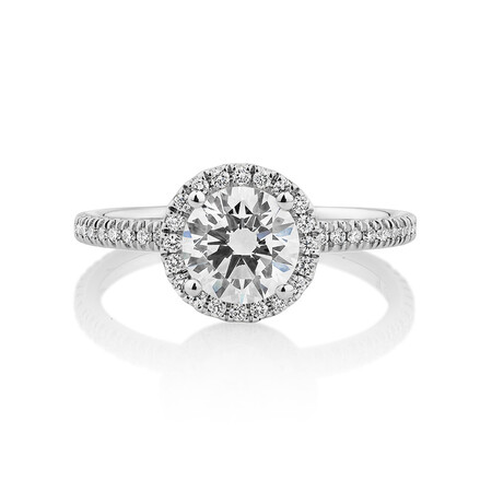 Halo Engagement Ring with 1.23 Carat TW of Diamonds. A 1 Carat Round Brilliant Laboratory-Created Centre Diamond and 0.23 Carat TW of Natural Diamonds in the Shoulders and Halo in 14kt White Gold Halo Engagement Ring with 1.23 Carat TW of Diamonds. A 1 Carat Round Brilliant Laboratory-Created Centre Diamond and 0.23 Carat TW of Natural Diamonds in the Shoulders and Halo in 14kt White Gold