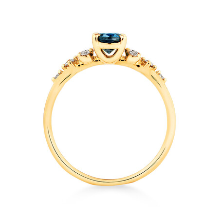 Ring with Blue Topaz and 0.12 Carat TW of Diamonds in 10kt Yellow Gold Ring with Blue Topaz and 0.12 Carat TW of Diamonds in 10kt Yellow Gold