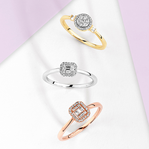 Flatlay of three promise rings, yellow gold, white gold and rose gold Flatlay of three promise rings, yellow gold, white gold and rose gold